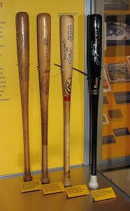 Autographed baseball bats like these are highly collectible and can command substantial prices.