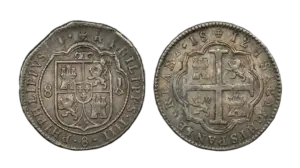 Two irregularly shaped Spanish Colonial 8 Reales silver "cob" coins recovered from a 1715 Fleet shipwreck, showing the Cross and Shield designs.