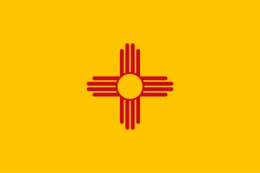 The New Mexico state flag, representing our service as a trusted New Mexico coin dealer.
