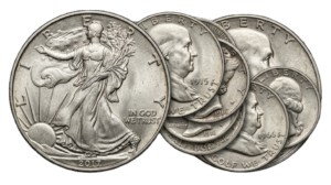 A montage of circulated 90% U.S. silver coins, including Walking Liberty and Franklin Half Dollars, used as tangible silver assets.