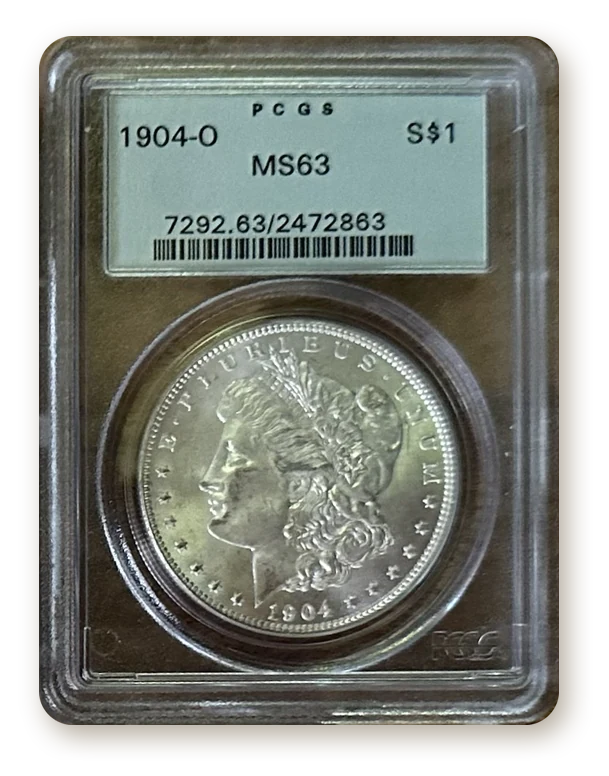 1904-O Morgan silver dollar certified MS63 by PCGS in a green-label holder