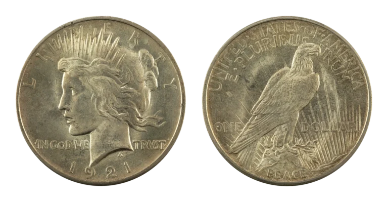 1921 high relief Peace silver dollar, obverse with Liberty in a radiate crown and reverse with an eagle perched on a rock above the word PEACE