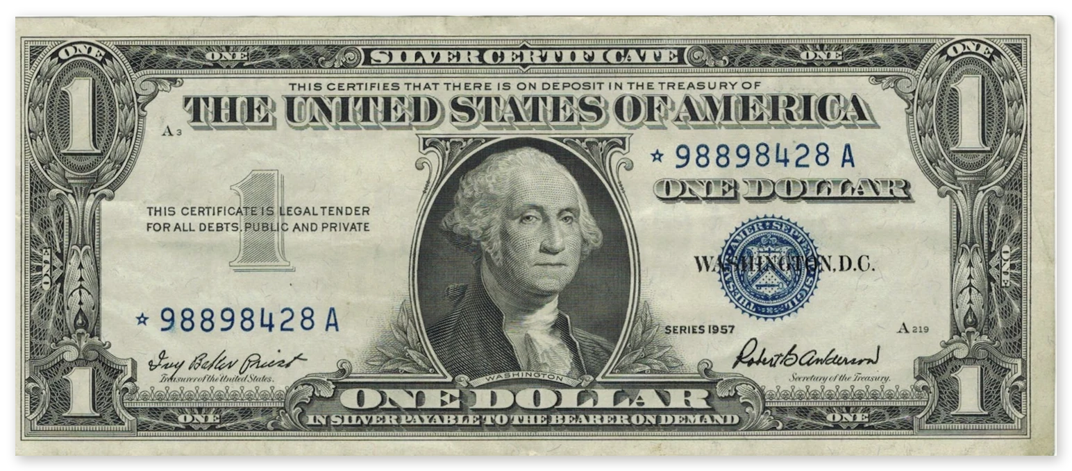 A Series 1957 $1 silver certificate star note with a star before each serial number and a blue seal