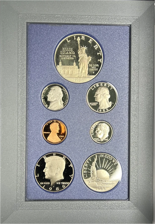 1986 U.S. Mint Prestige Proof Set in its case with the Statue of Liberty commemorative half dollar and silver dollar and the regular proof coins