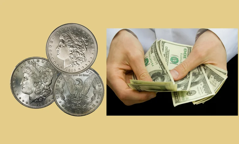 Hands counting $100 bills next to a stack of Morgan silver dollars