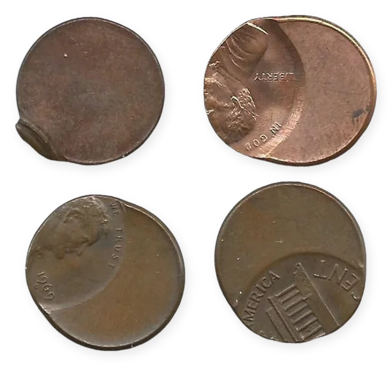 Four Lincoln cent error coins: a clipped planchet cent and three off-center strikes