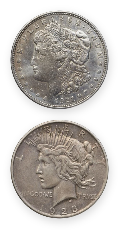 A 1921 Morgan silver dollar above a 1923-D Peace silver dollar, at true relative size