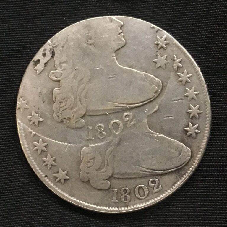 Fake 1802 Draped Bust silver dollar made to look double struck