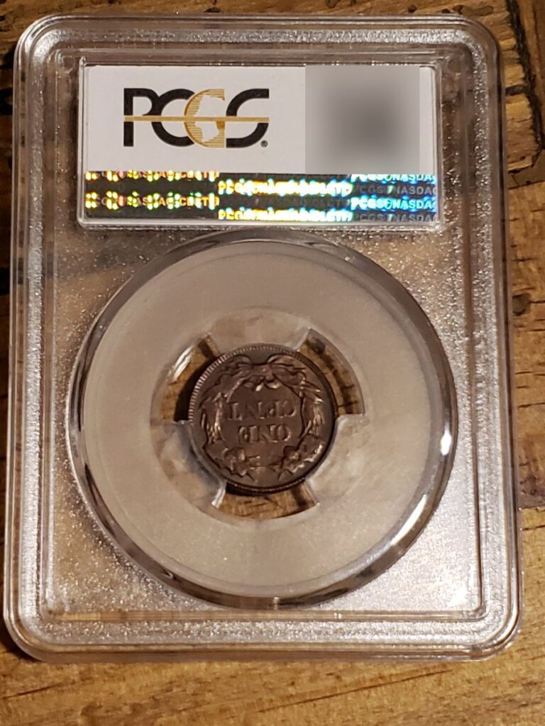 Counterfeit 1856 Flying Eagle cent in a PCGS-style holder, holder back