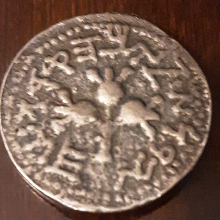 Counterfeit ancient Judean shekel with pomegranates