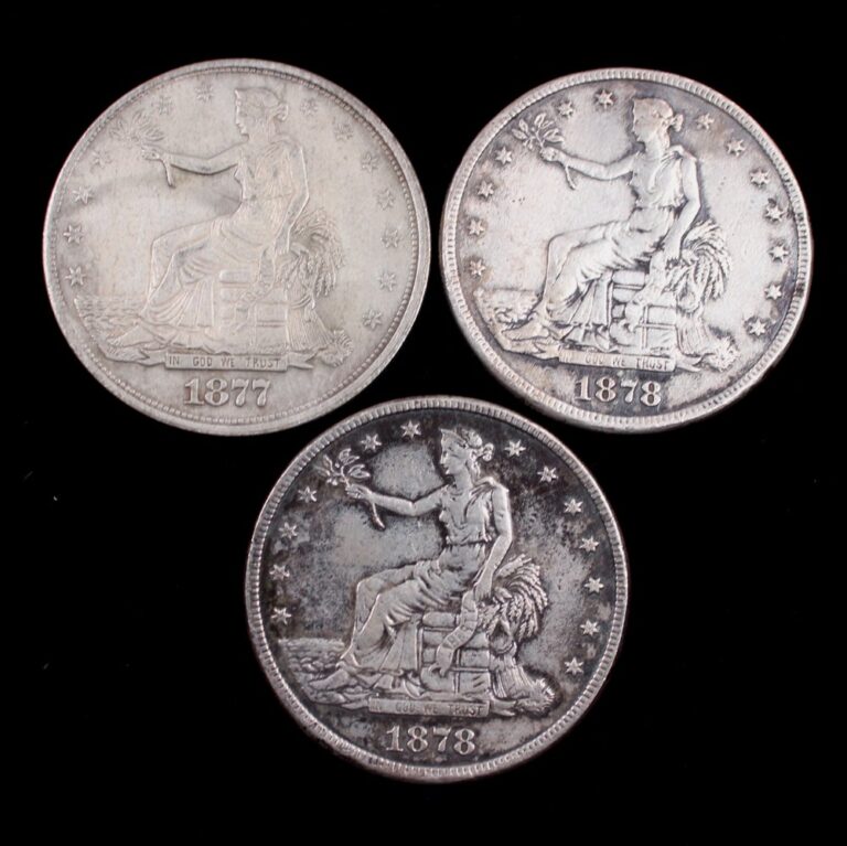 Three counterfeit trade dollars dated 1877 and 1878