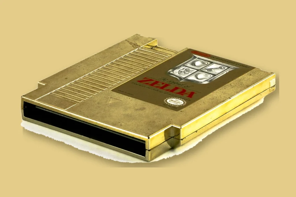 Original gold-colored The Legend of Zelda NES game cartridge from 1986 on a gold background