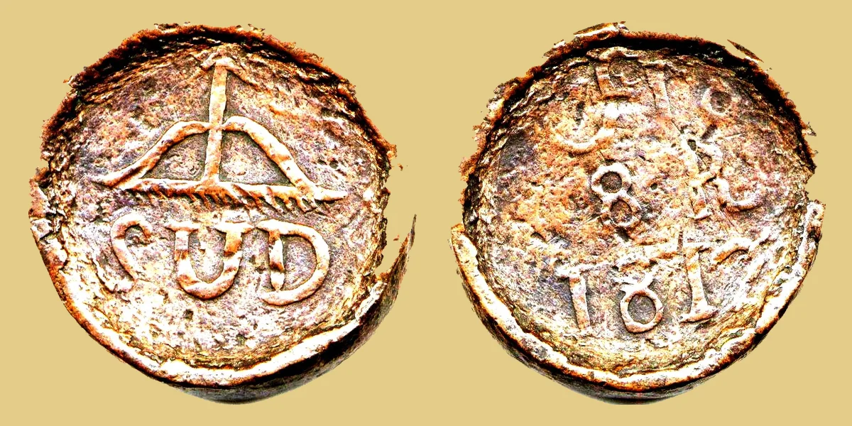 8 reales de cobre SUD de 1812 de Morelos, de la Guerra de Independencia de México, con el arco y la flecha sobre SUD y el monograma de Morelos con 8 R 1812