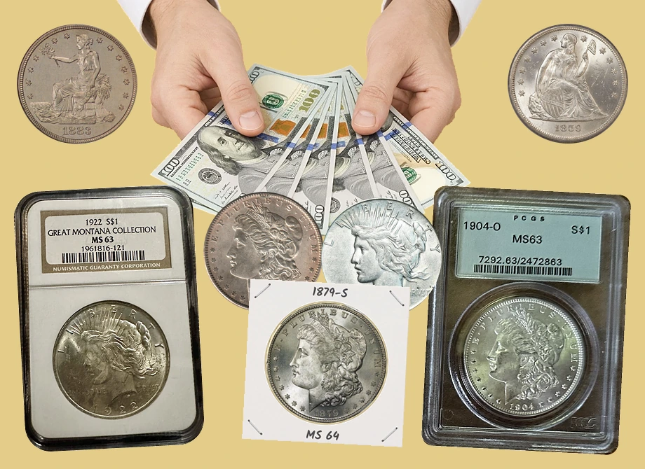 Hands in white shirt cuffs offering $100 bills, with an NGC 1922 Peace dollar slab, a PCGS 1904-O Morgan dollar slab, Morgan, Peace, Seated Liberty and Trade silver dollars and a Morgan in a 2x2 flip