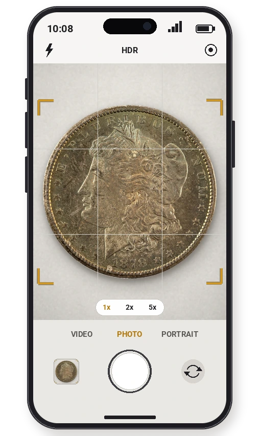 Smartphone camera app framing an 1878-CC Morgan silver dollar with focus brackets and a shutter button, taking a photo of a coin for a free appraisal
