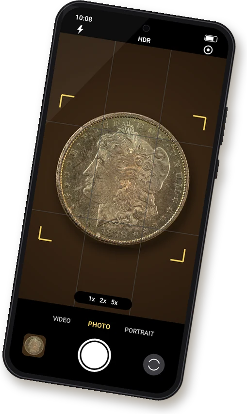 Smartphone camera app framing an 1878-CC Morgan silver dollar with focus brackets and a shutter button, taking a photo of a coin for a free appraisal