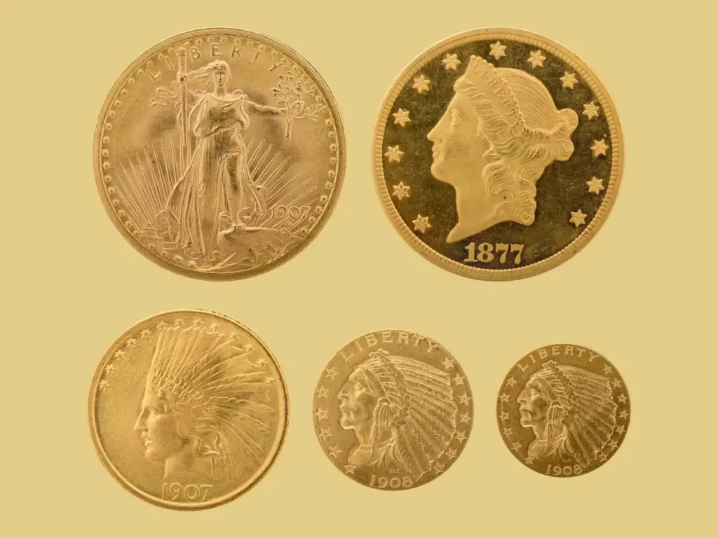 Saint-Gaudens and Liberty Head double eagles with Indian Head ten, five and two and a half dollar gold coins on a gold background