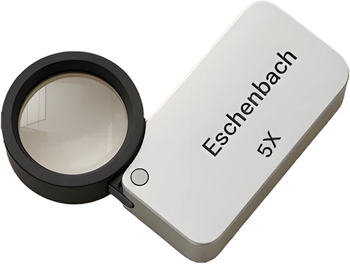 Eschenbach 5X folding loupe with its lens swung open, the magnifier our coin buyers use for a free appraisal, cut out on a transparent background