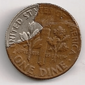 This is an example of a Roosevelt dime with a pealed lamination error.