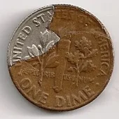 This is an example of a Roosevelt dime with a pealed lamination error.