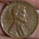 The obverse of a faked Lincoln cent mint error, an example of altered or counterfeit coins.