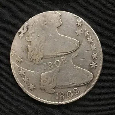A fake 1802 double struck Bust silver half dollar, an example of a sophisticated counterfeit coin.